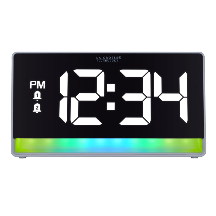 Hed-on image of the 617-149 Digital Alarm Clock with Color Changing Glow Light, the alarm clock features a white case, a color-changing bar at the base shown in blues and greens, and a black display with white digits.
