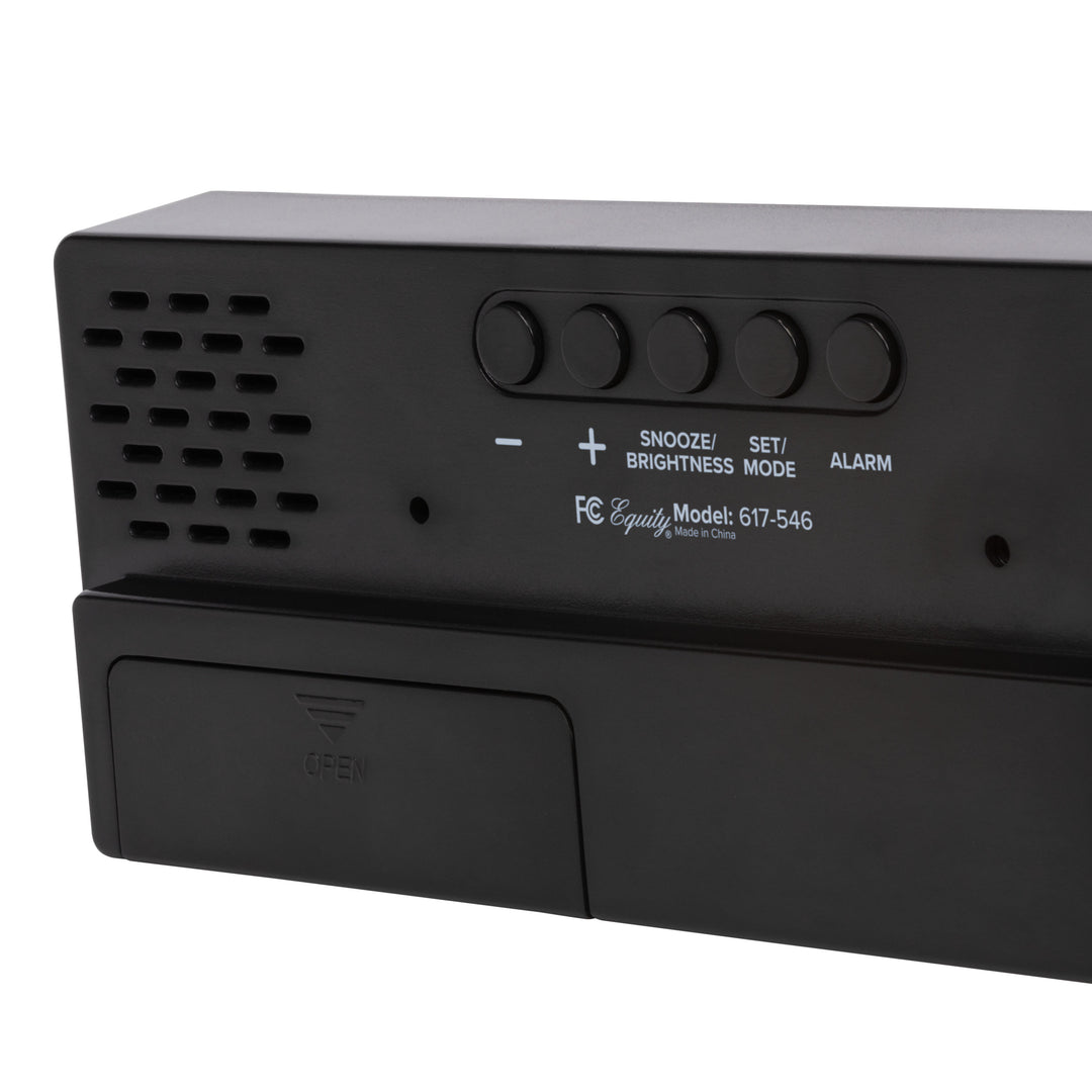 Close-up image of the back of the 617-546 2.0-inch Red LED Alarm Clock with indoor temperature showing the button functions and the battery compartment.