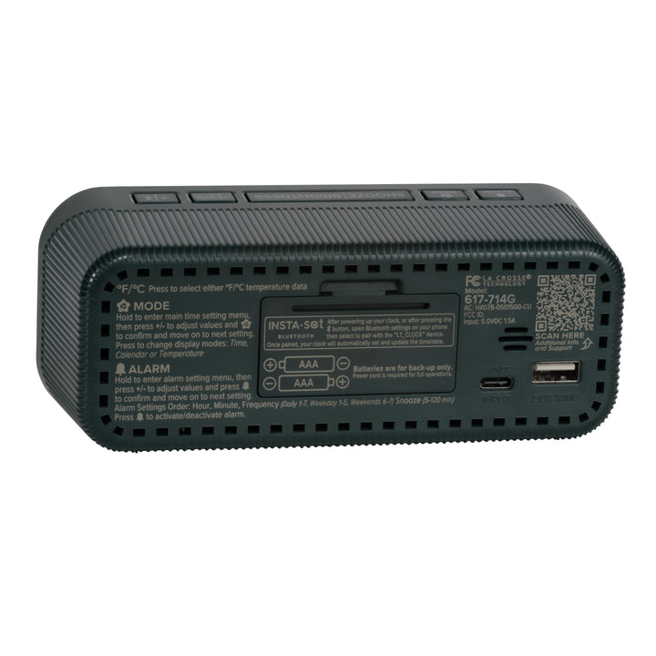 Angled back view of the 617-714G Insta-Set Digital LED Alarm Clock with Bluetooth® Technology - Green, showing the buttons, the battery compartment, the USB-C power port, the USB-A charging port, and the operating instructions.