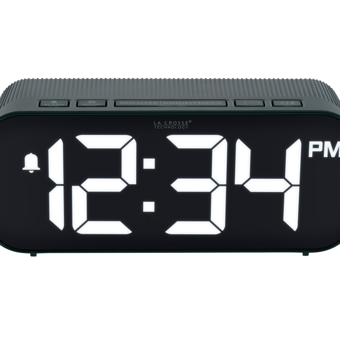 Close-up image of the buttons of the 617-714G Insta-Set Digital LED Alarm Clock with Bluetooth® Technology - Green. The alarm clock features large white digits, a PM indicator, and an alarm icon in a green case.