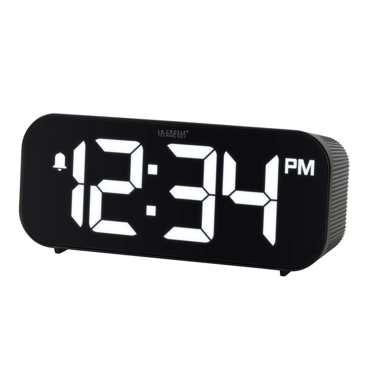 Left-facing image of the 617-714 Insta-Set Digital LED Alarm Clock with Bluetooth® Technology - Black. The alarm clock features large white digits, a PM indicator, and an alarm icon in a black case.
