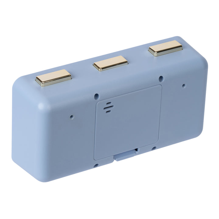 Angled back image of the 636-379BL Daily Flip Tabletop Clock with Calendar – Blue, showing the battery compartment with the cover in place, and the three brass buttons to operate the calendar and the alarm.