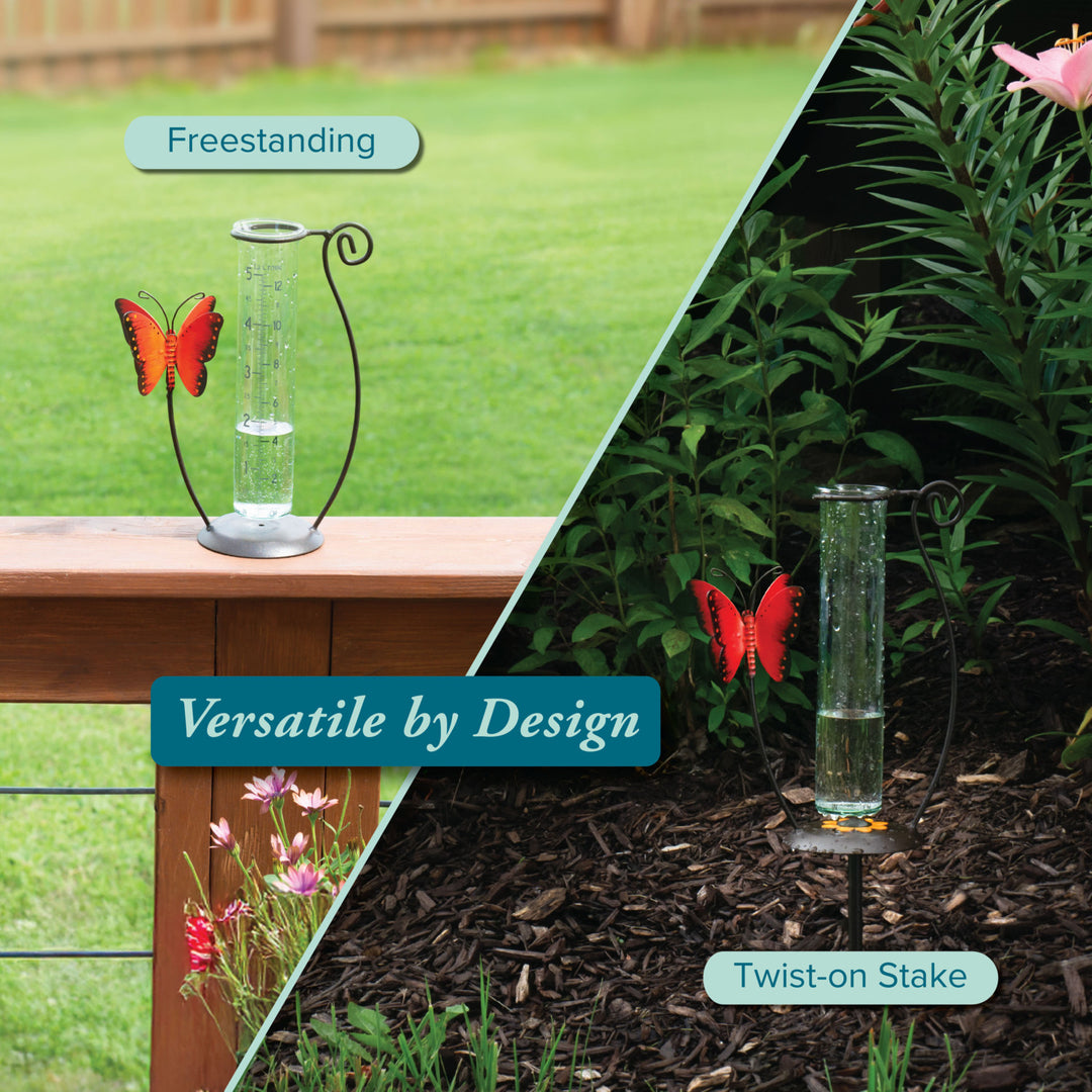 704-13077 Glass rain gauge with butterfly design on a stand and stake against a garden background.