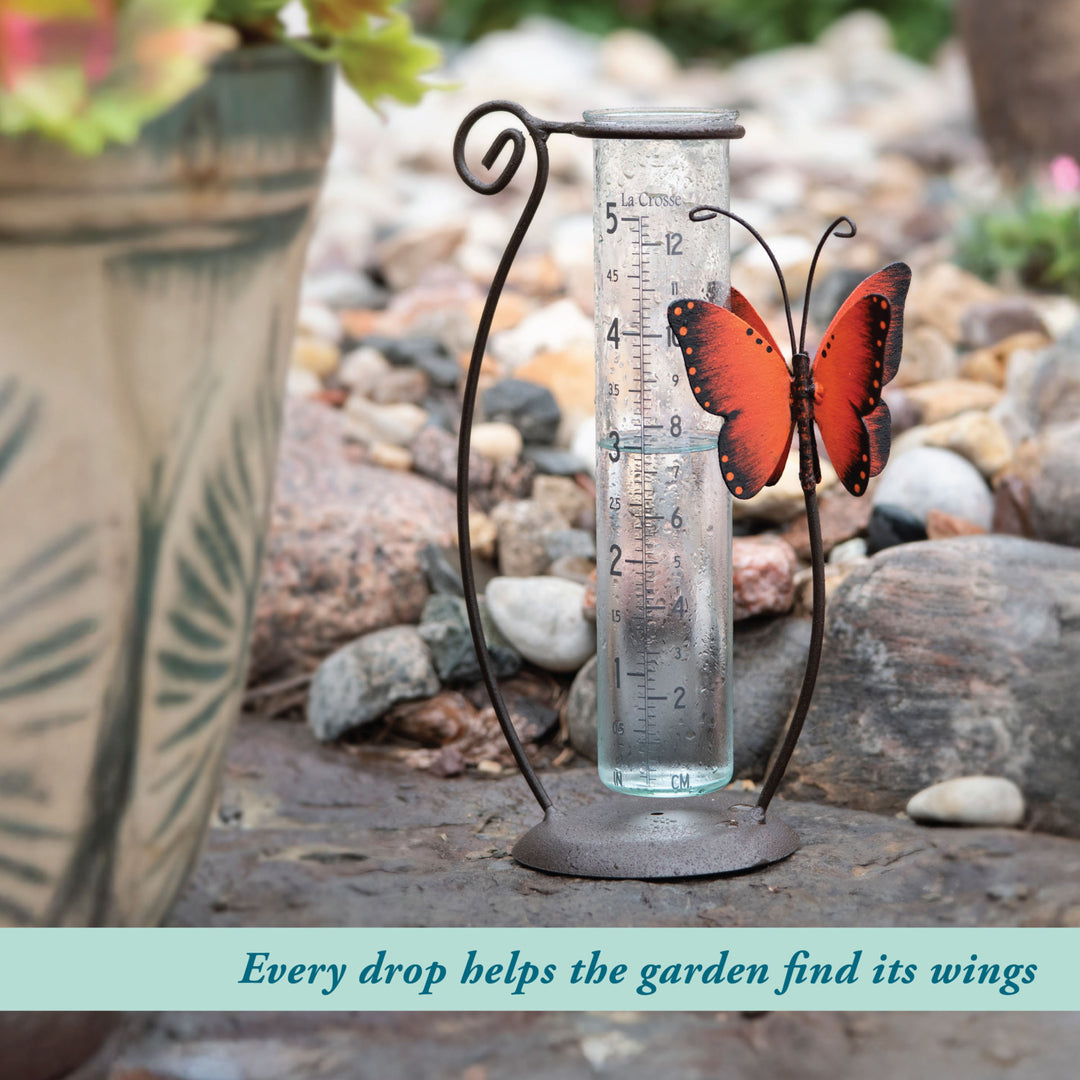 704-13077 Decorative rain gauge with butterfly design on a garden background