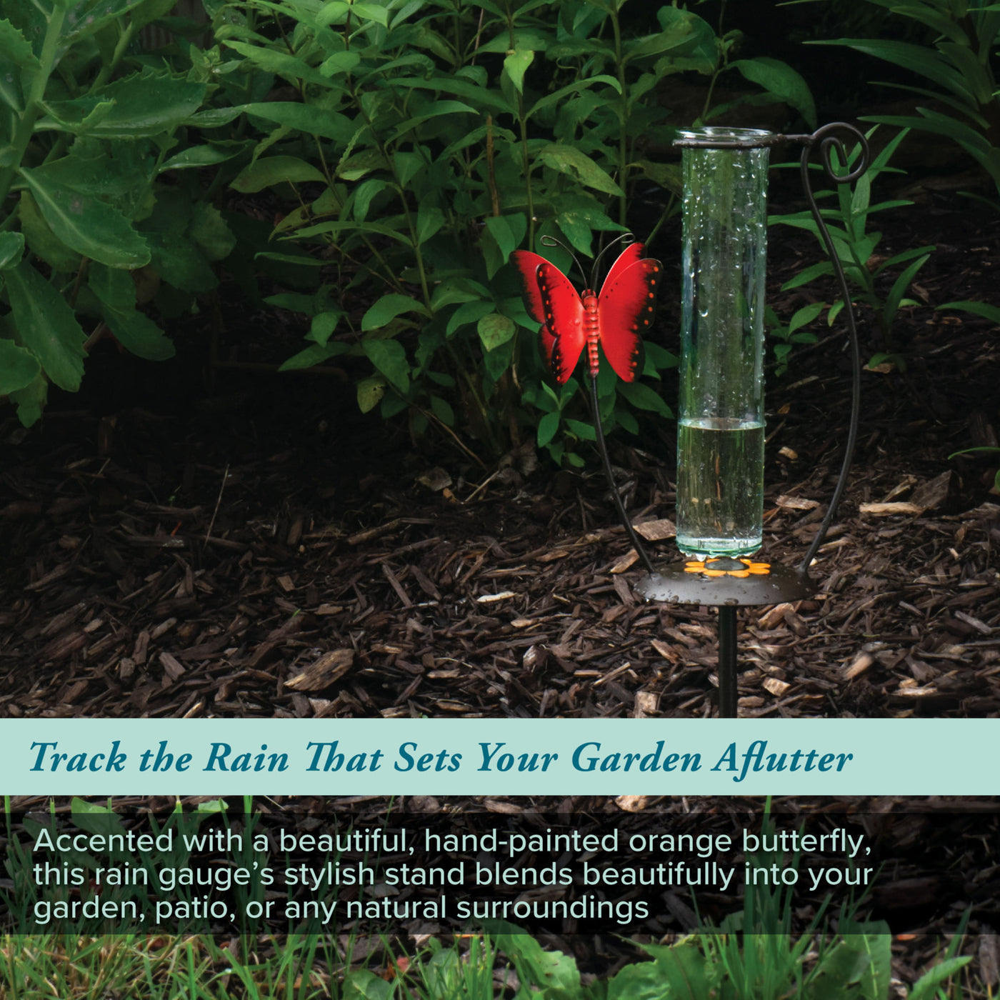 704-13077 Rain gauge with a hand-painted orange butterfly in a garden setting