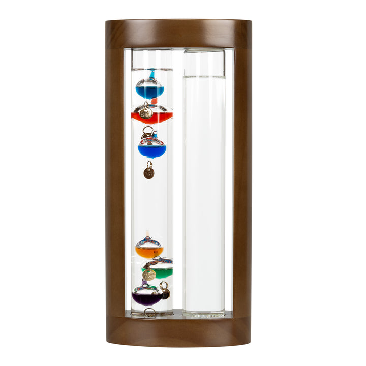 Headon image of the 914-4928SG 11-inch Galileo Thermometer + FitzRoy Storm Glass. The thermometer features a solid walnut-finished wooden casing with two glass tubes: one with floating temperature spheres in various colors, and the second containing a changing liquid that indicates the forecast.