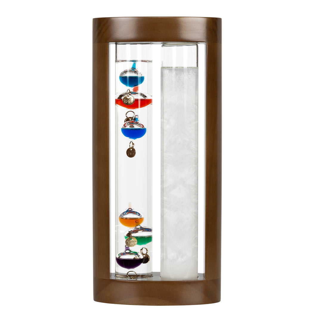 Headon image of the 914-4928SG 11-inch Galileo Thermometer + FitzRoy Storm Glass. The thermometer features a solid walnut-finished wooden casing with two glass tubes: one with floating temperature spheres in various colors, and the second containing a changing liquid that indicates the forecast.