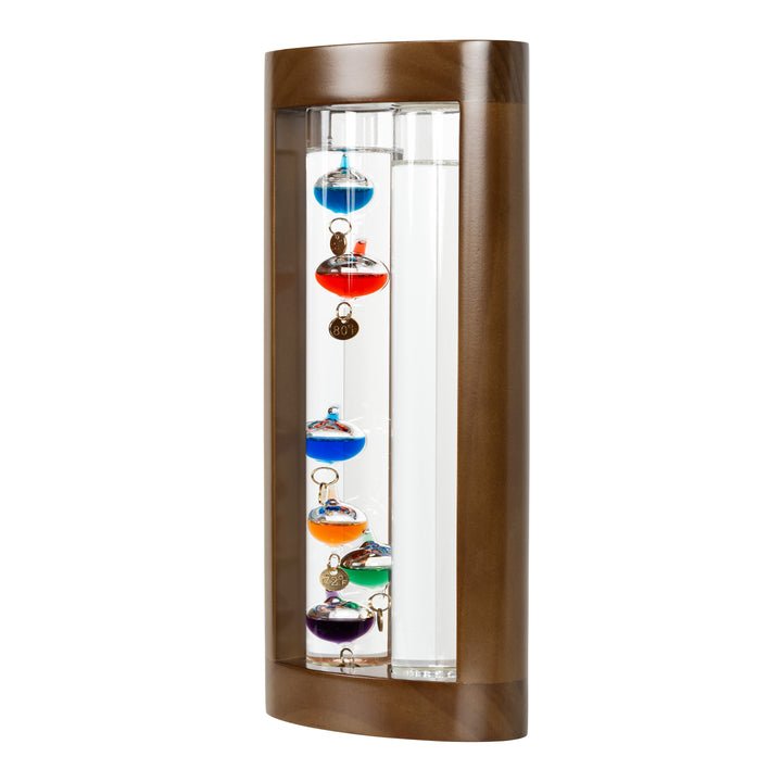 Left-facing image of the 914-4928SG 11-inch Galileo Thermometer + FitzRoy Storm Glass. The thermometer features a solid walnut-finished wooden casing with two glass tubes: one with floating temperature spheres in various colors, and the second containing a changing liquid that indicates the forecast.