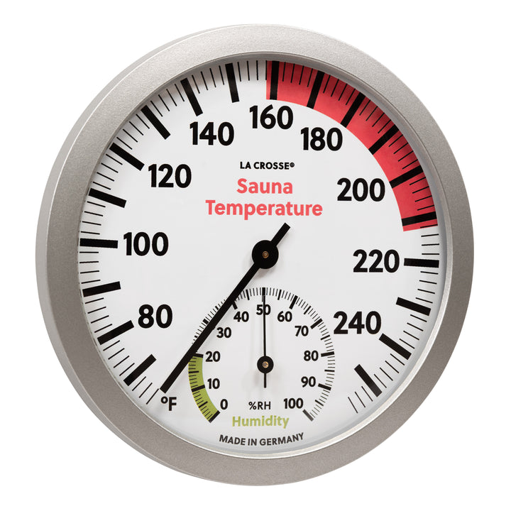 Right-facing image of the 914-612 Sauna Thermometer with Hygrometer. The thermometer features a slimline silver frame, black temperature readings from 65 degrees Fahrenheit to 255 degrees Fahrenheit, with optimal temperature highlighted in red from 158 to 212 degrees Fahrenheit, with a black pointer. The hygrometer displays the humidity readings in relative humidity %RH in black digits from 0 to 100 percent showing the optimal range in green 0 to 20 percent relative humidity with a black pointer.