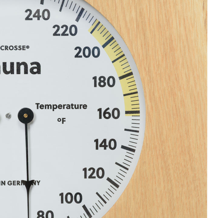 Close up image of the temperature gauge of the 914-620 Sauna Thermometer and Hygrometer in a wood frame showing the black pointer and the temperature in degrees Fahrenheit.
