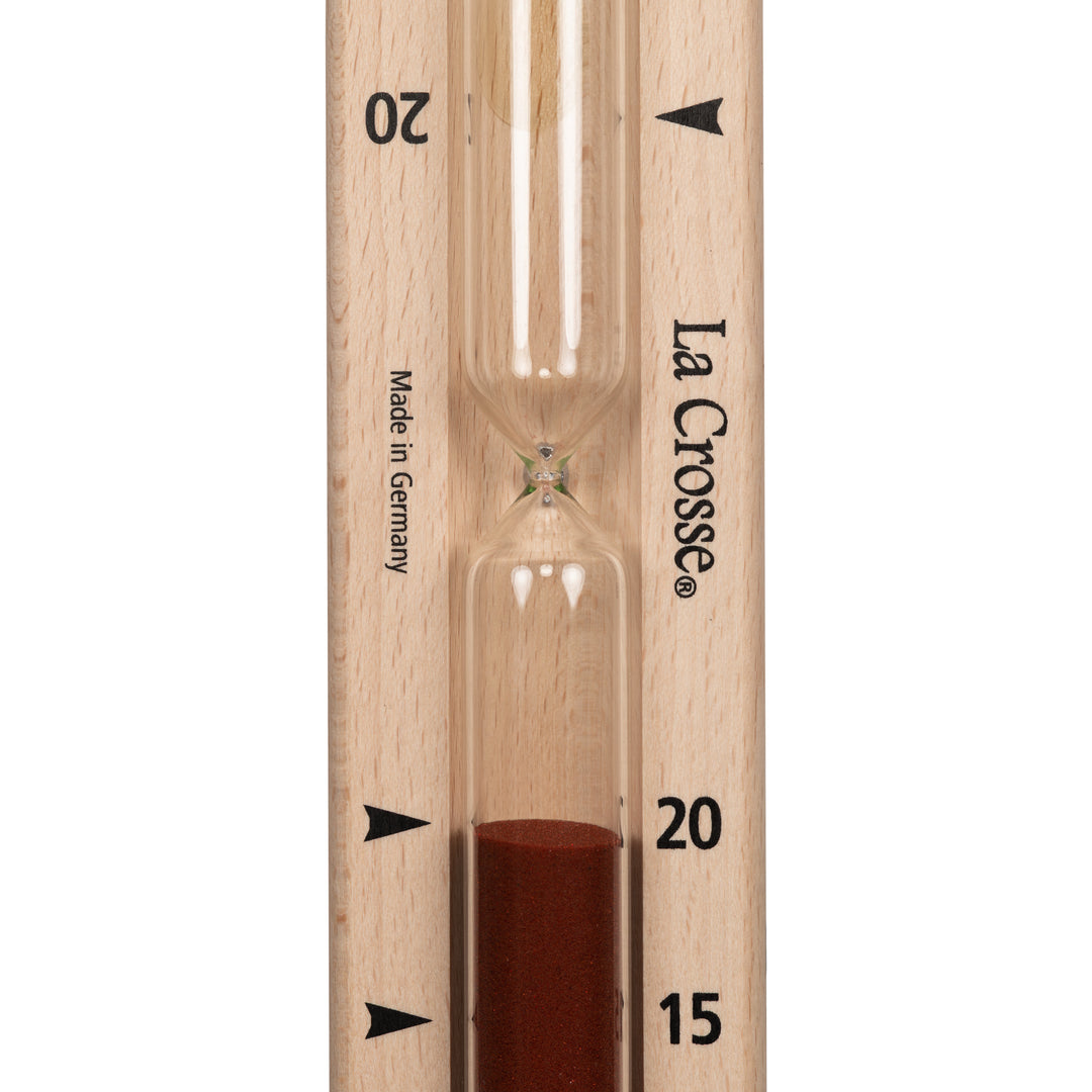 Close up detail of the hourglass tube of the 918-631 Sauna Hourglass Timer showing the wood casing, glass tube, and red sand with markings 15 and 20 minutes and the La Crosse logo
