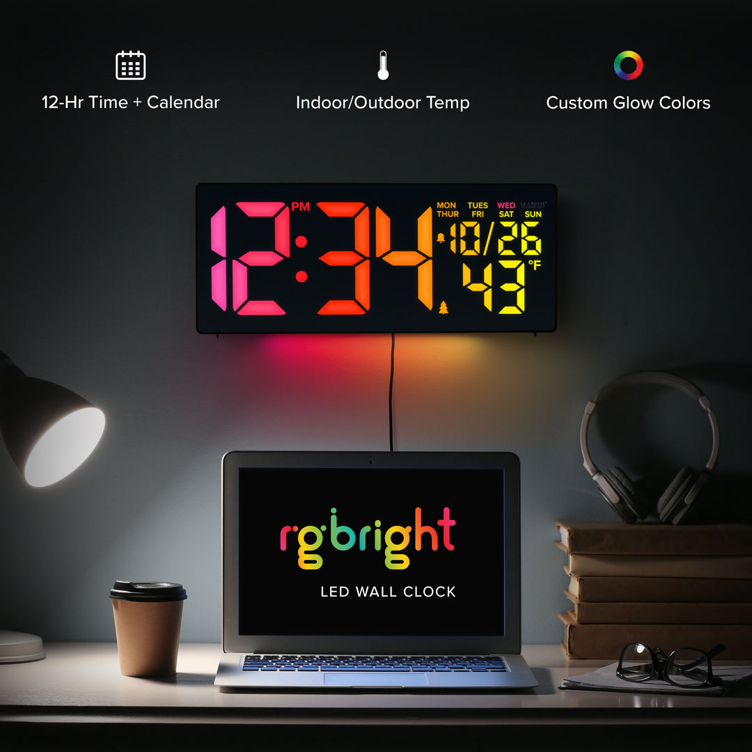 S69548 R.G.Bright LED Wall Clock with Outdoor Temperature and Underglow displayed in a modern desk setup with colorful LED digits and ambient underglow lighting. Image highlights 12-hour time with calendar, indoor/outdoor temperature monitoring, and customizable glow colors with RGB lighting effects.